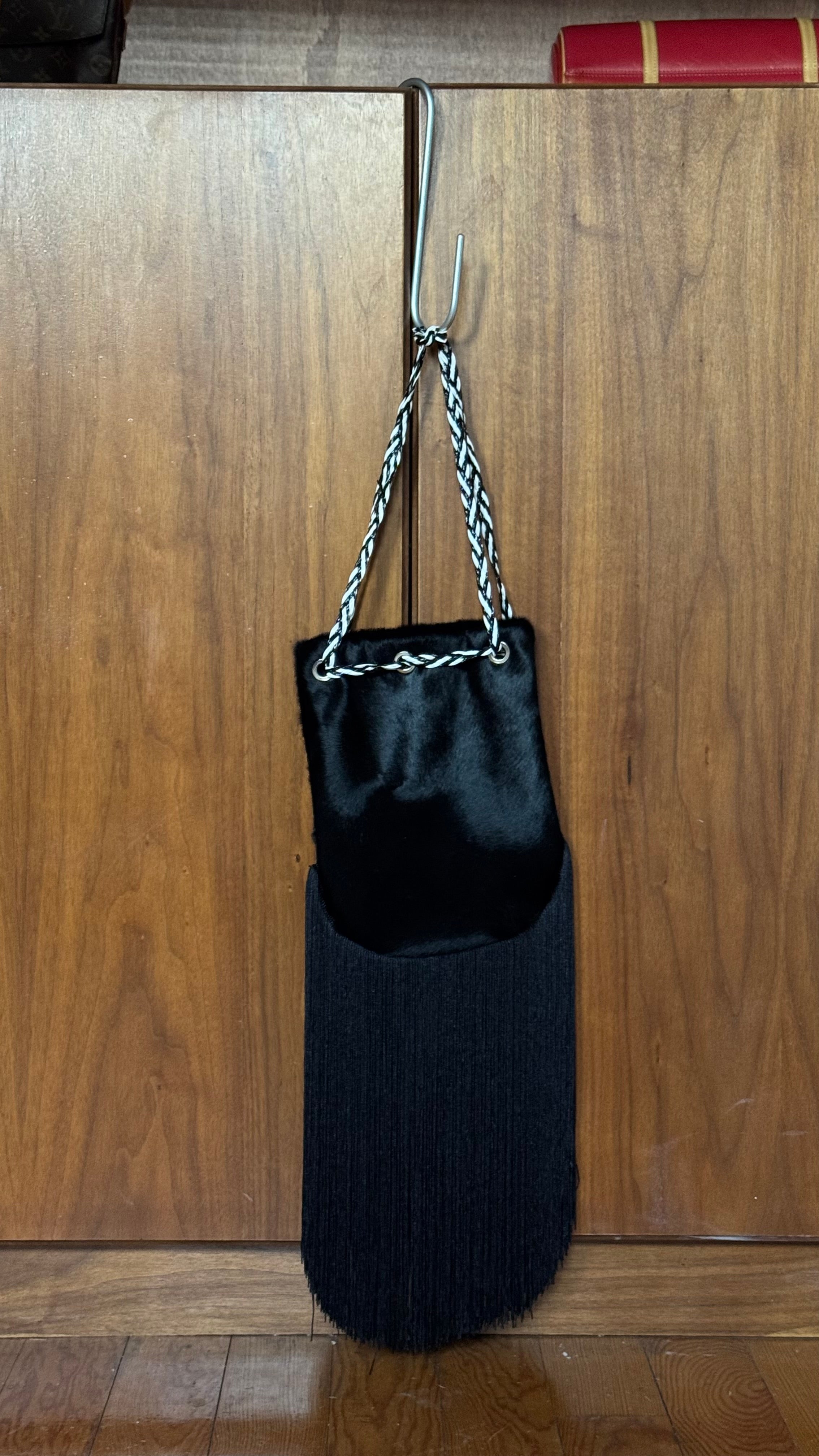 Pony hair fringed bucket bag