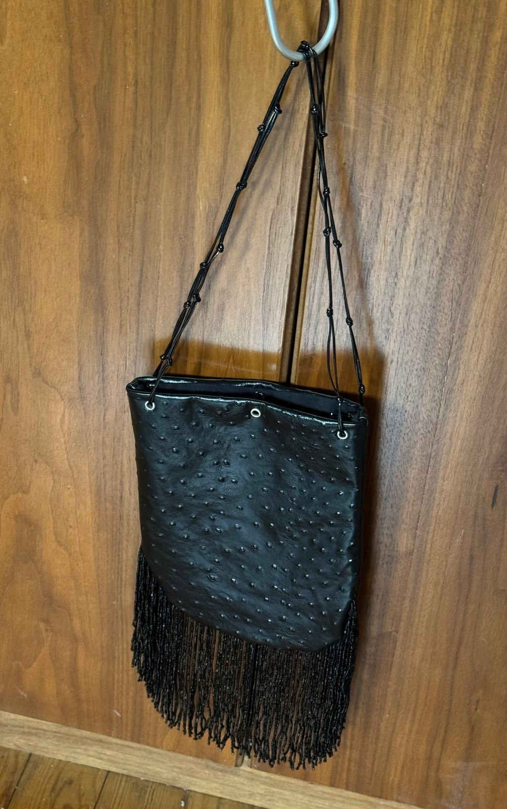 Ostrich print fringed bucket bag