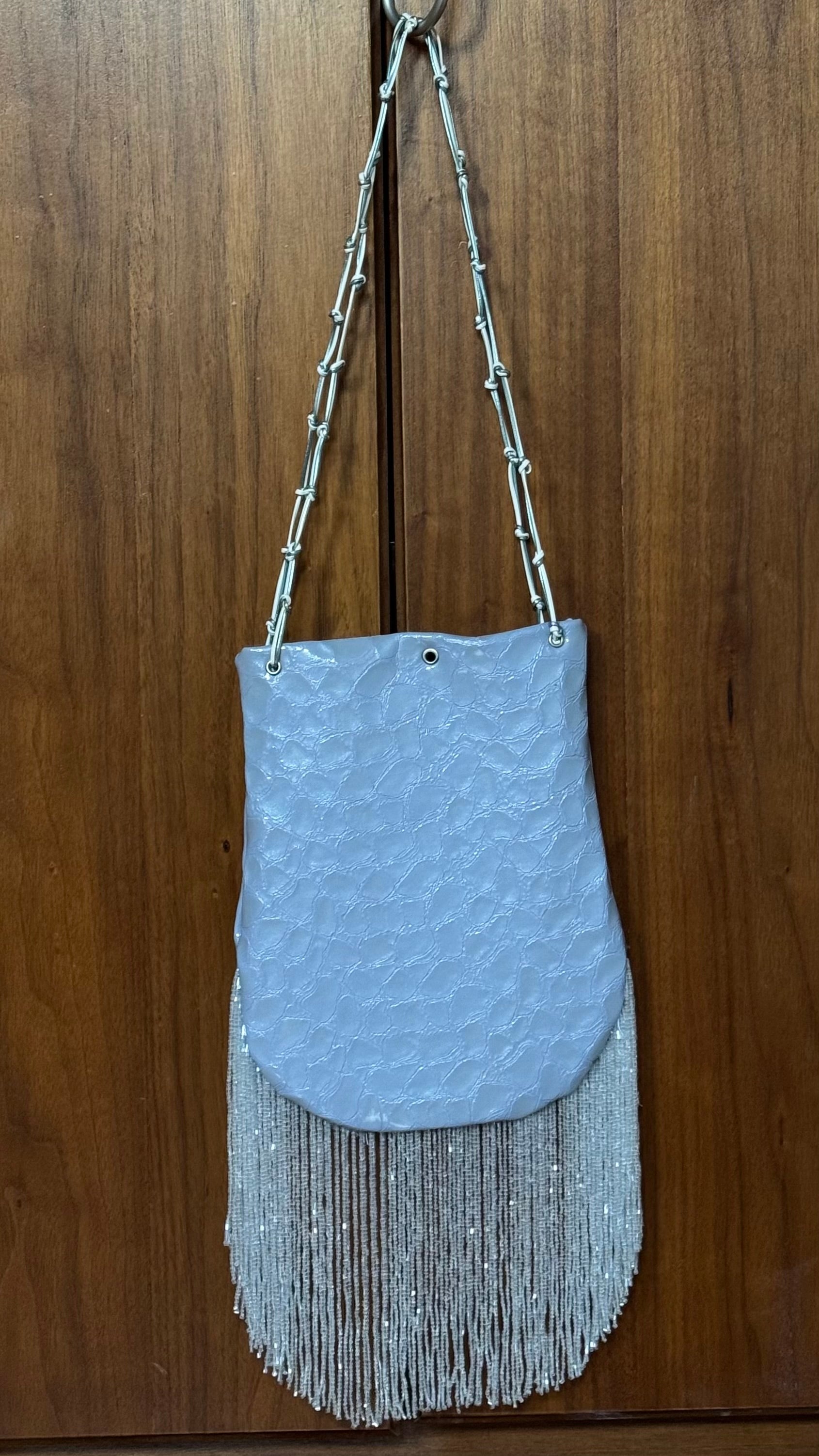 Crocodile embossed fringed bucket bag