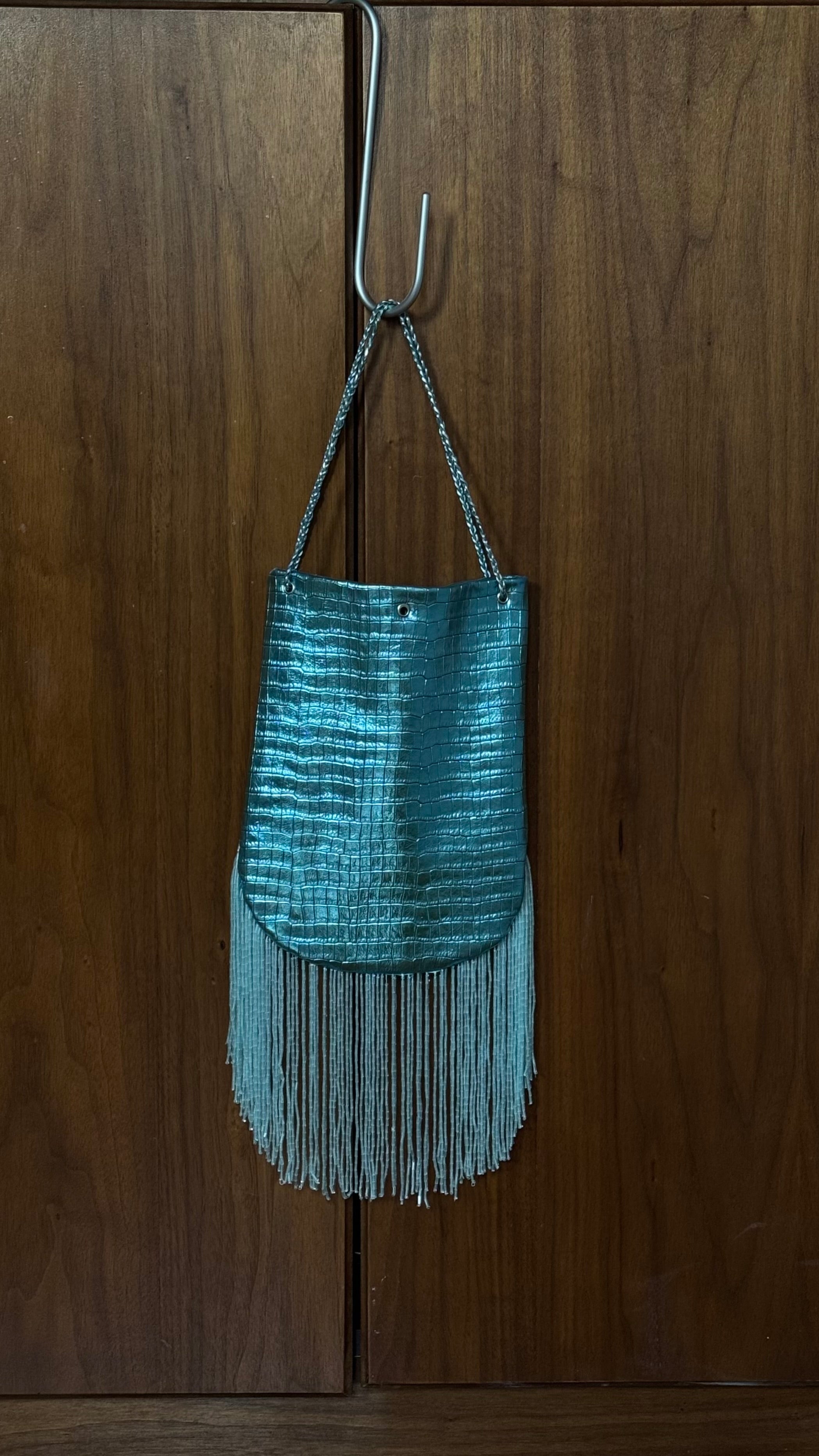 Crocodile embossed fringed bucket bag