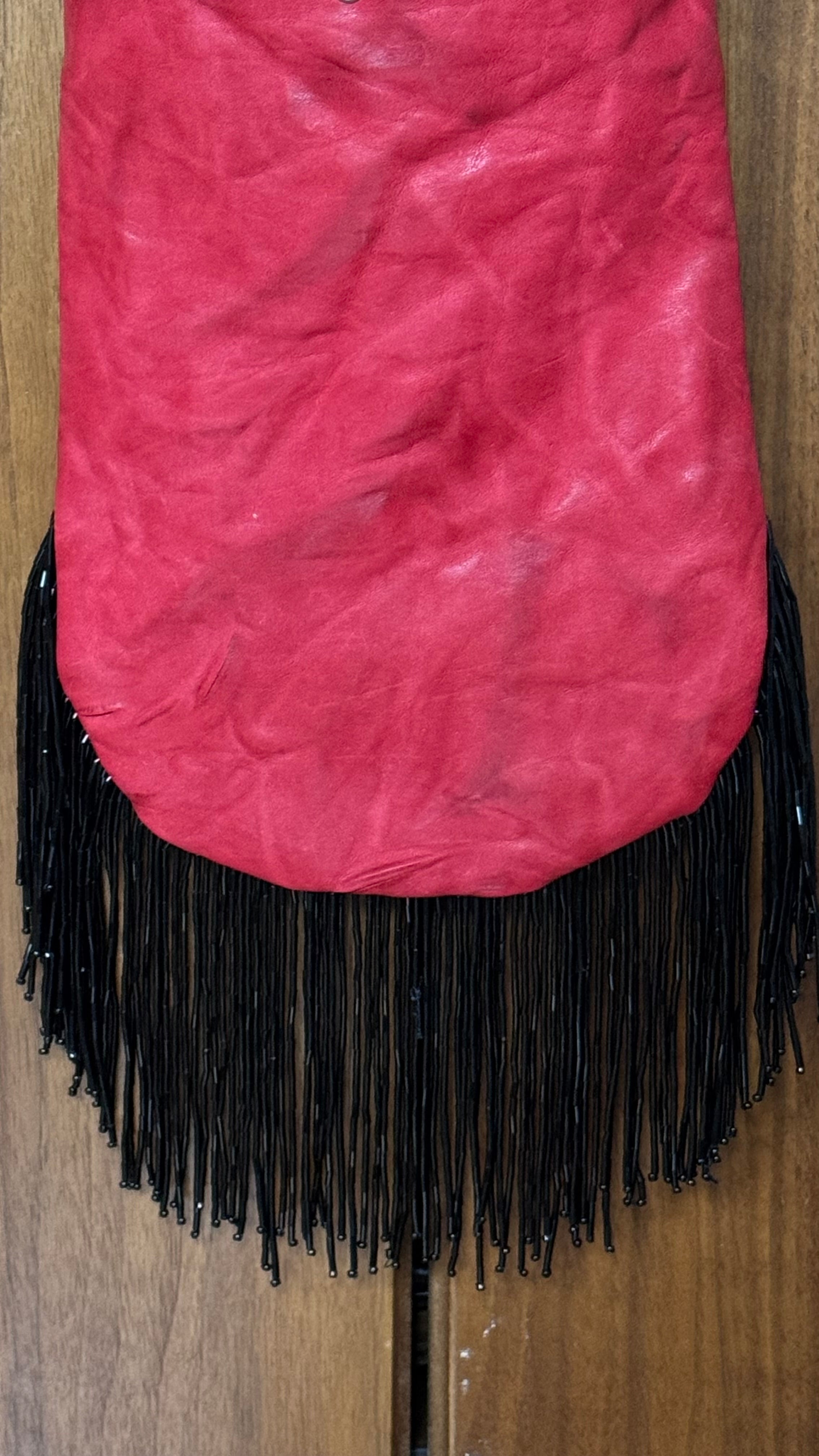 Red fringed bucket bag