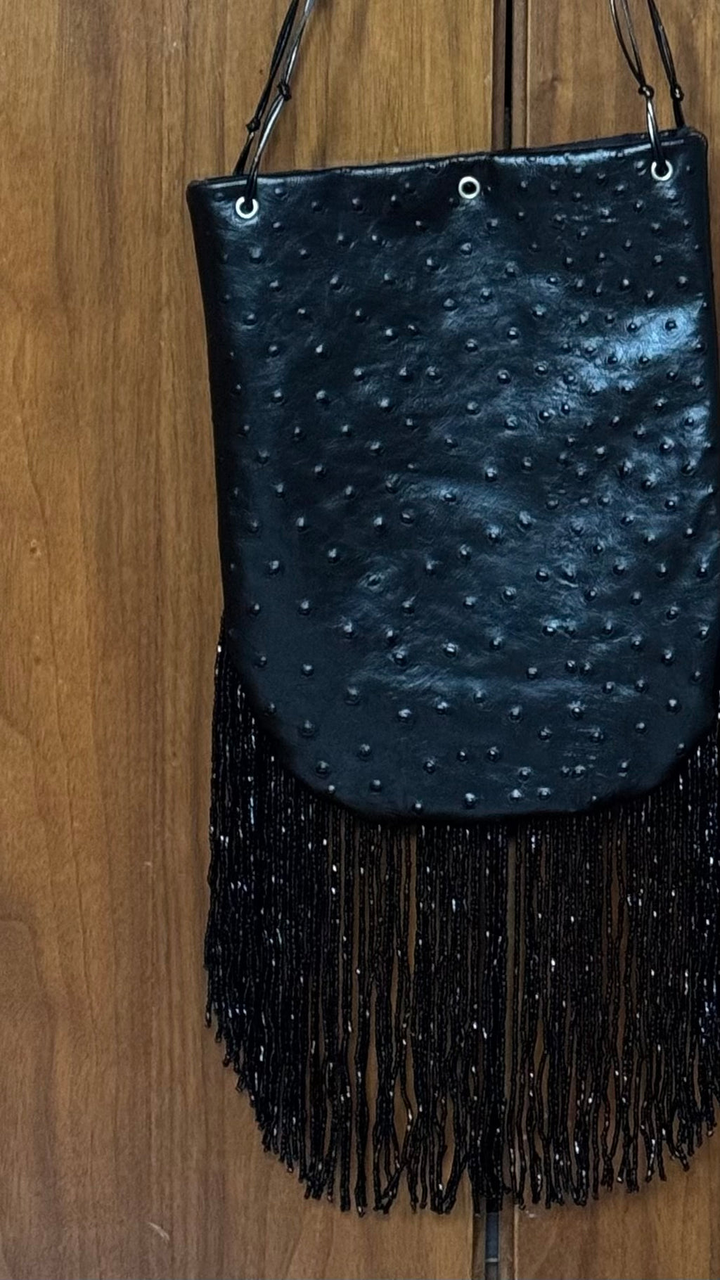 Ostrich print fringed bucket bag