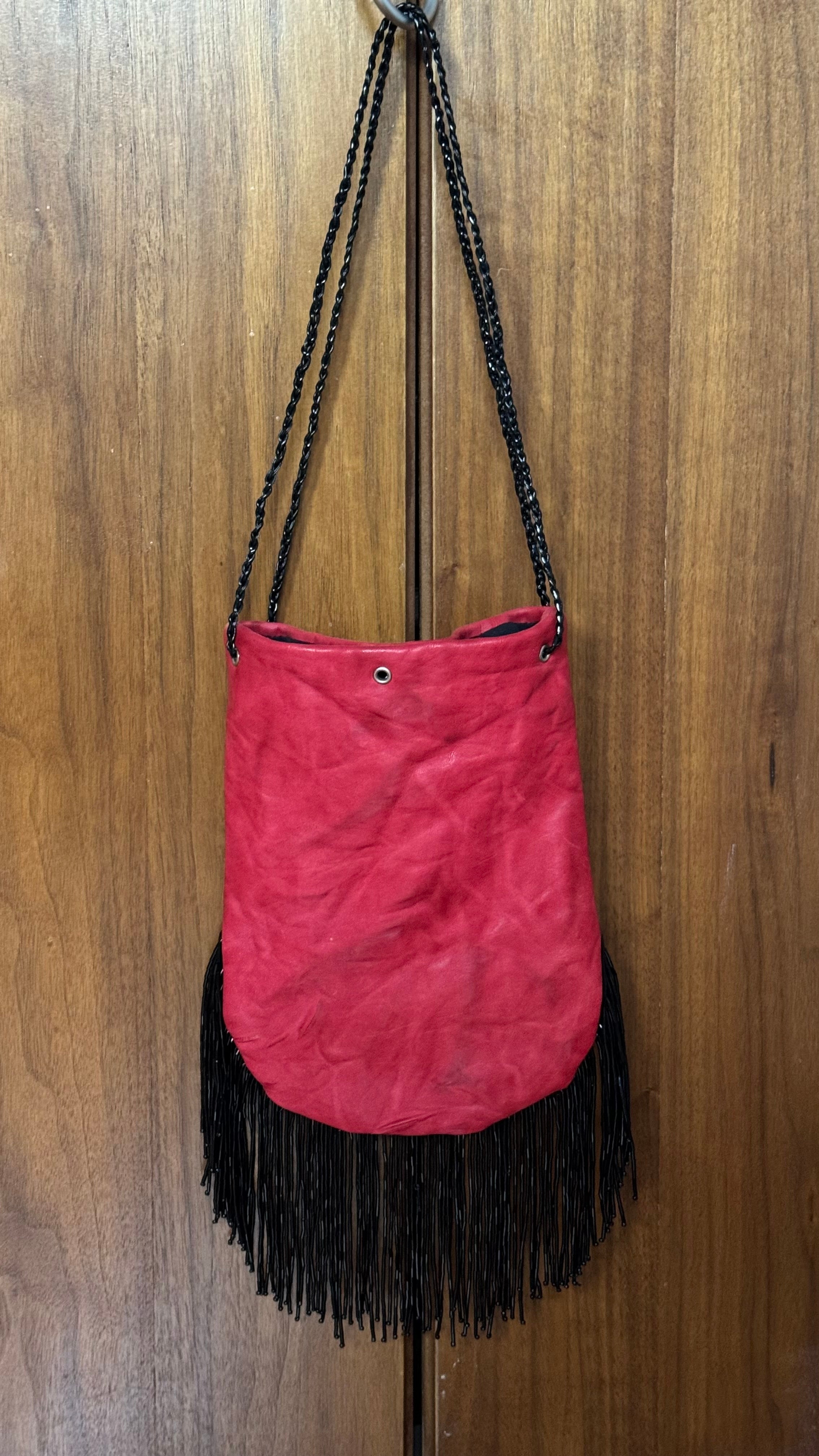 Red fringed bucket bag