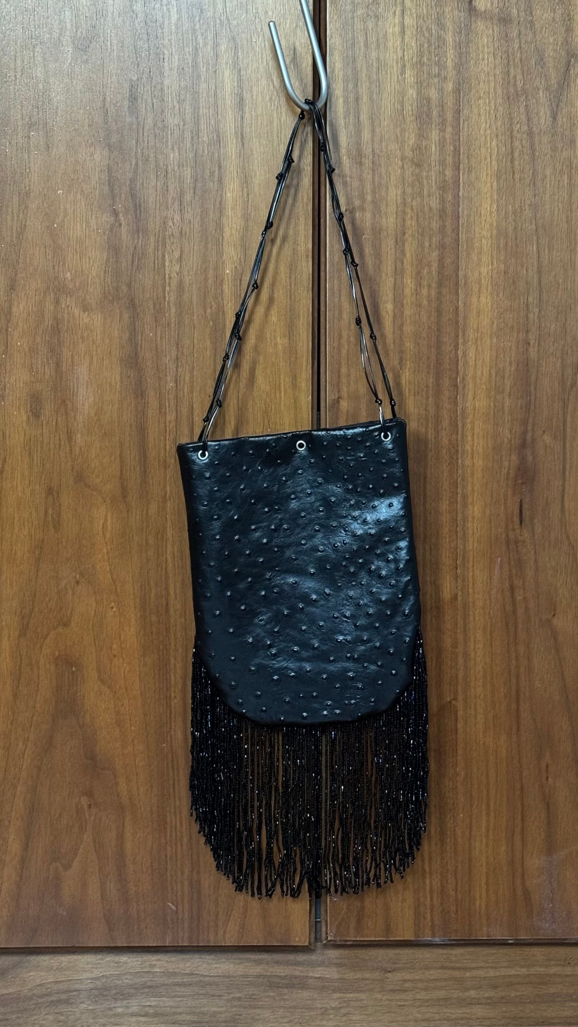 Ostrich print fringed bucket bag