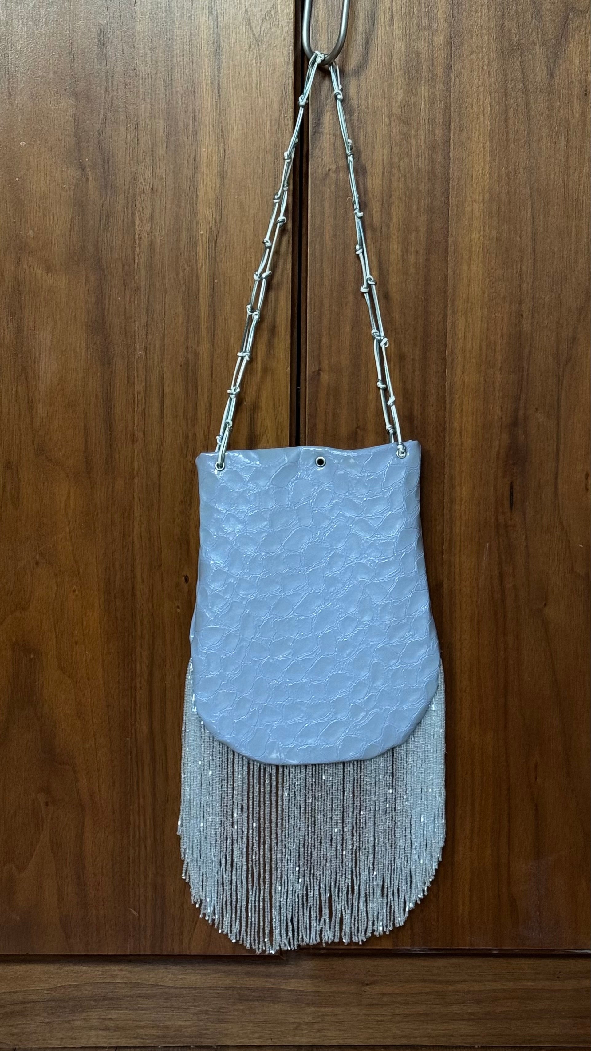 Crocodile embossed fringed bucket bag