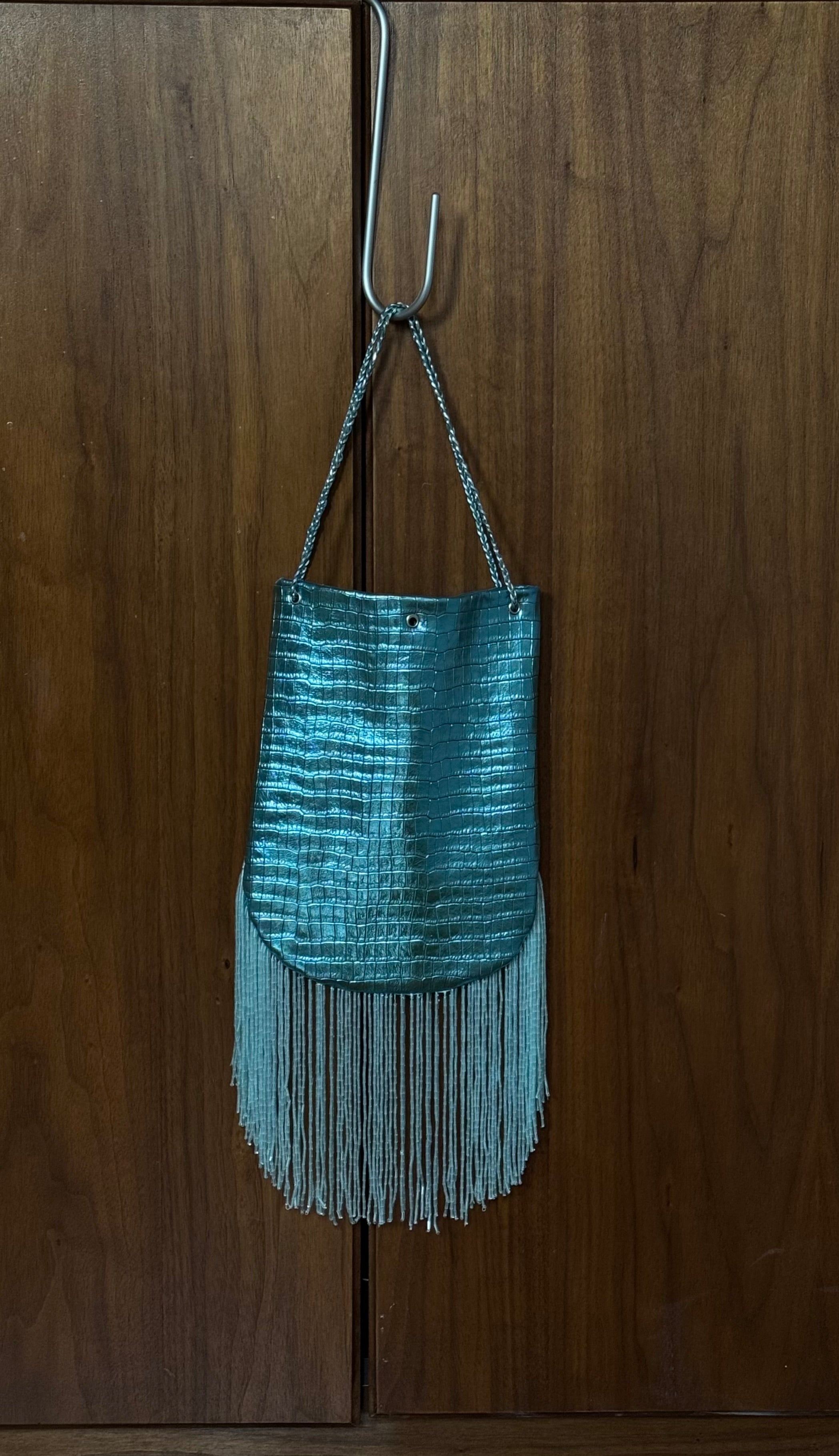 Crocodile embossed fringed bucket bag