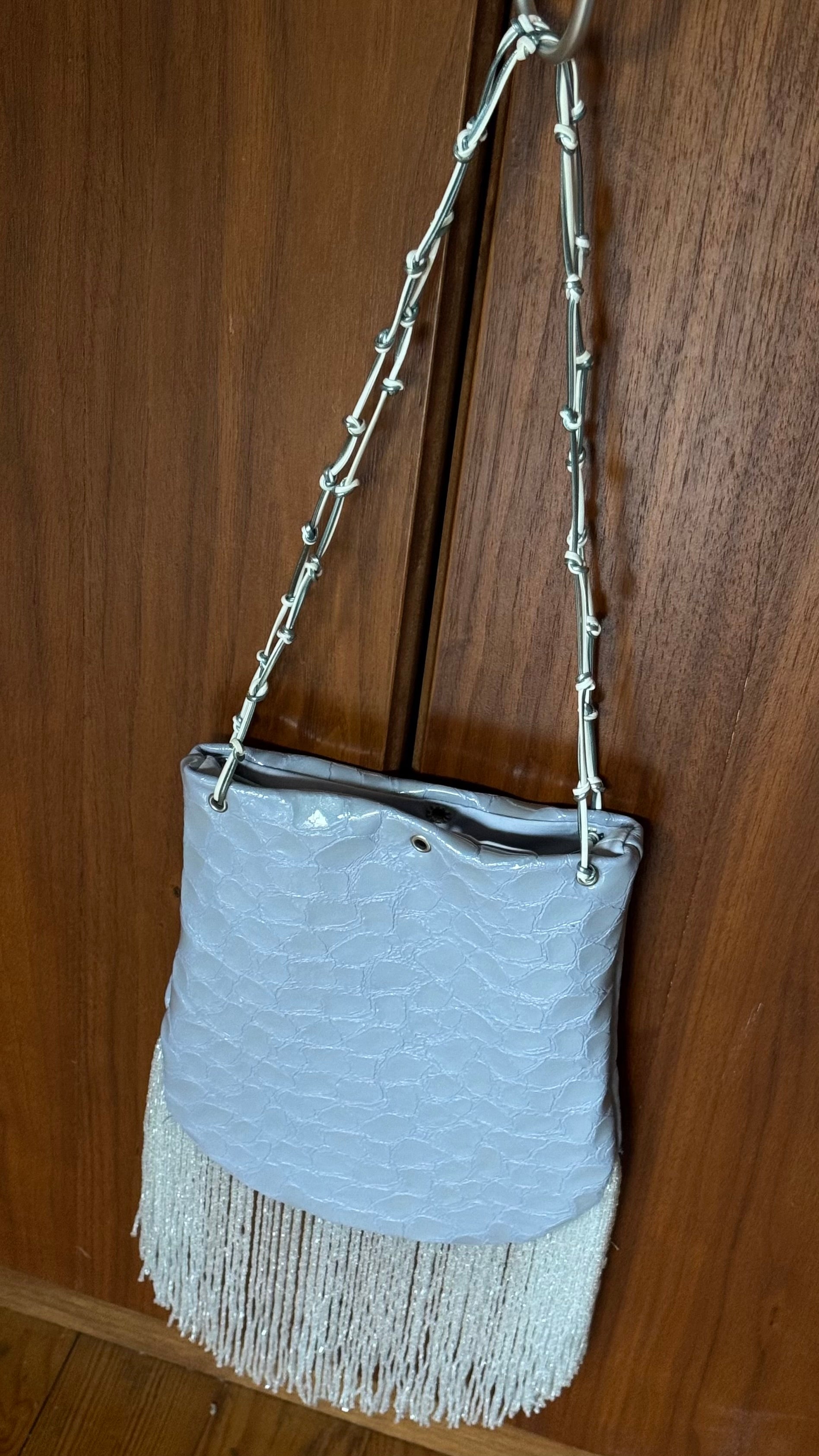Crocodile embossed fringed bucket bag