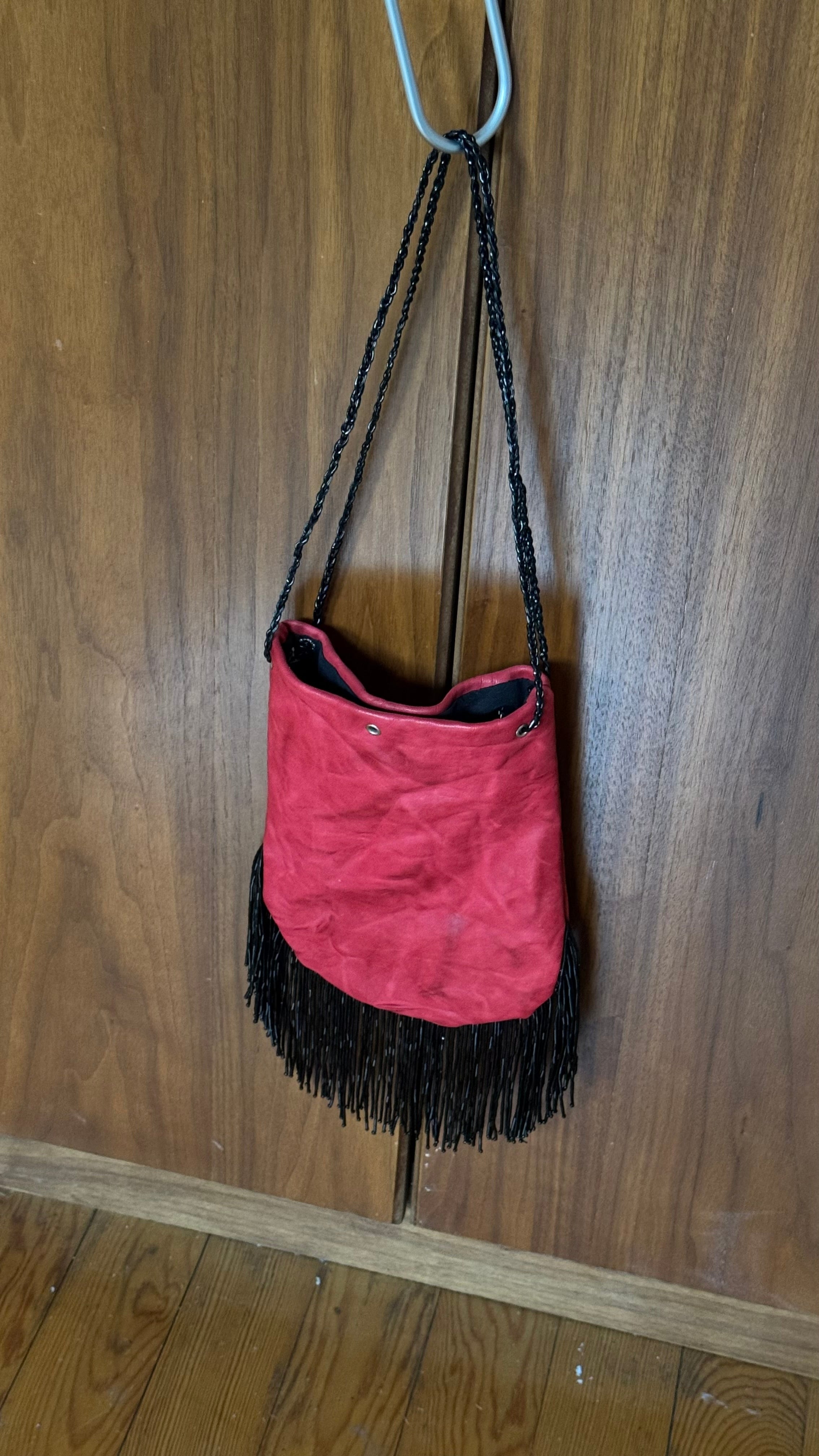 Red fringed bucket bag